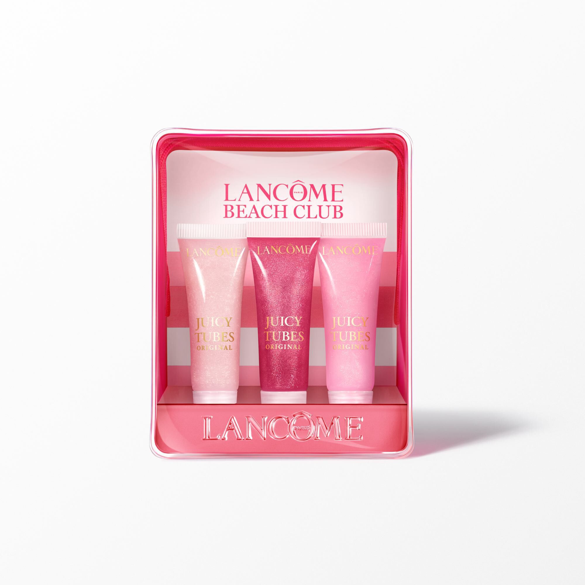 Setul de Lancome Juicy Tubes cu pouch roz cu model cu dungi in spatele a trei recipiente cu nuanțe de luciu de buze diferite.