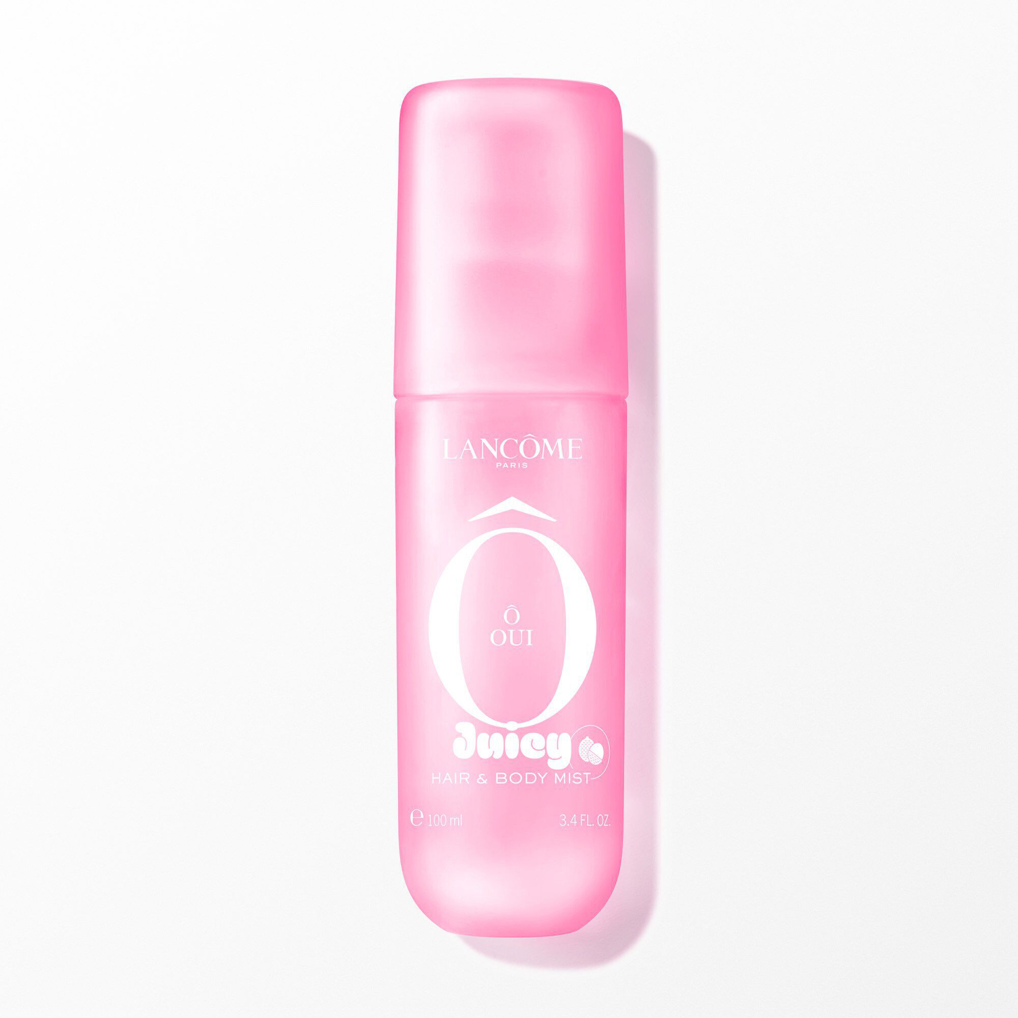 Un ambalaj de O Oui Mist Spray de Corp & Păr Lancome de culoare roz aprins.