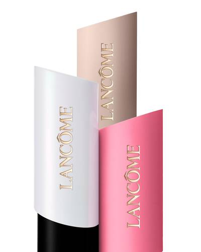 Aranjament format din trei fonduri de ten Lancome Teint Idole Shape Stick Foundation, Highlighter și Blush in nuanțe de alb, bej și roz.