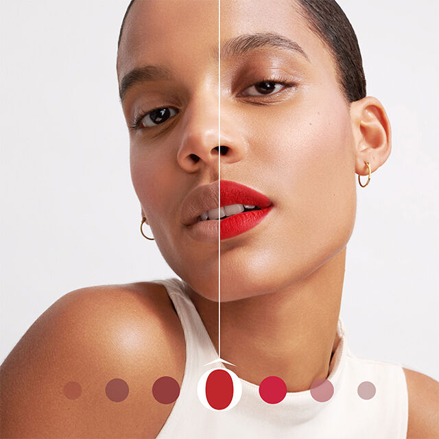 Femeie cu machiaj ușor și buze roșii, arătand un aspect natural și elegant, pe un fundal alb.