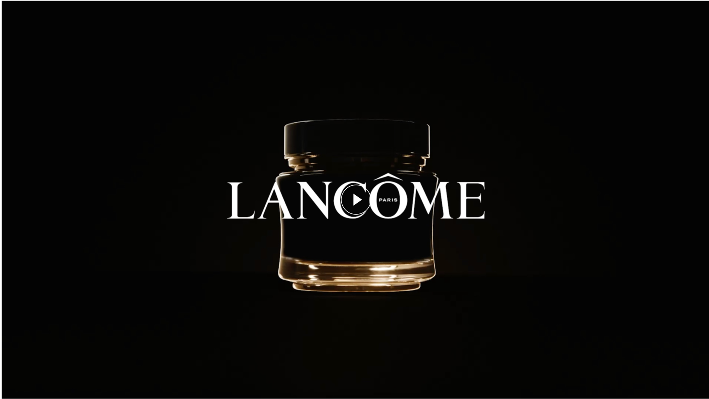 Borcan elegant de cremă Lancôme, luminat subtil pe fundal negru, evidențiind brandul de lux.